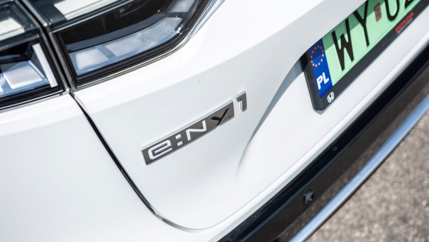 Honda e:Ny1 logotyp